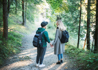 Traveler couple in love enjoying in the forest. Freedom and active lifestyle concept.