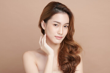 Beautiful young asian woman with clean fresh skin on beige background, Face care, Facial treatment, Cosmetology, beauty and spa, Asian women portrait.