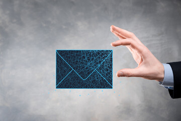 Businessman hand holding letter icon,email icons.Contact us by newsletter email and protect your...