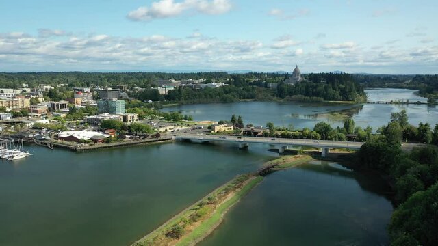 Cinematic 4K aerial drone dolly shot of the Olympia Yacht Club near the Washington State Capitol Building and Campus, Capitol Lake, with a panoramic view of Historic District in Olympia, Washington