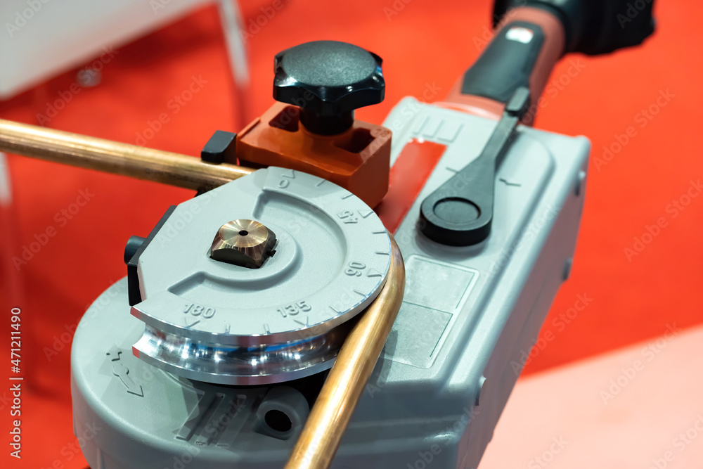 Poster equipment for bending pipes. bending copper pipe. mechanical device for creating bend on pipe. devic