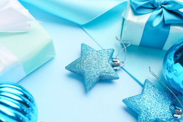 Beautiful Christmas decor with gifts on blue background