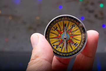 Compass  in hand as a concept of traveling and finding your life