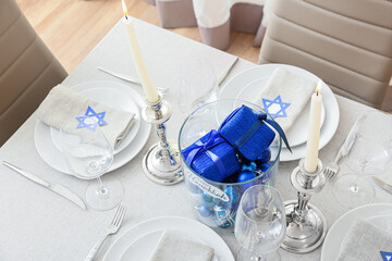 Beautiful table setting for Hanukkah celebration in dining room