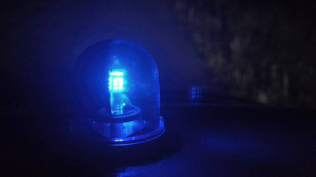 Shooting of rotating blue emergency light in the night