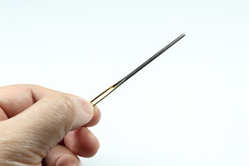 Large Eye Yarn Needle steel or Wool needle isolated on the white background. Tool for hand sewing.