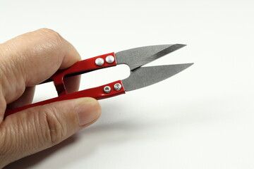 Traditional old design of scissors in Asia isolated on the white background. Classic tailor clipper made from metal blade.  