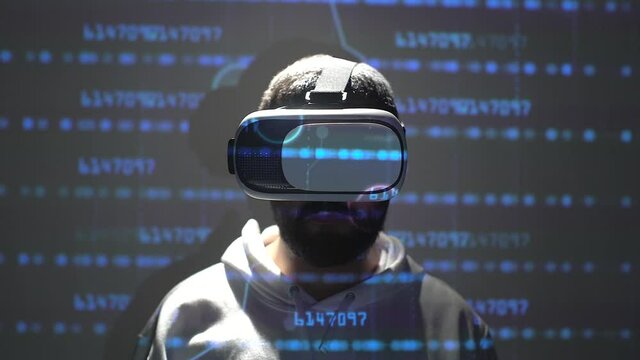 virtual reality programming concept. young man with virtual reality goggles with space copied a projection of numbers.
