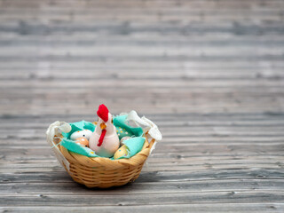 Easter eggs and chicken in a basket. Easter card with copy space for text.