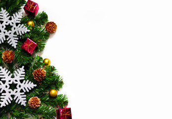 Christmas background with Christmas decorations and fir tree on white background