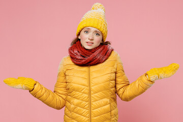 Confused shy sad upset shamed fatigued disconcerted young woman 20s years old wear yellow jacket...