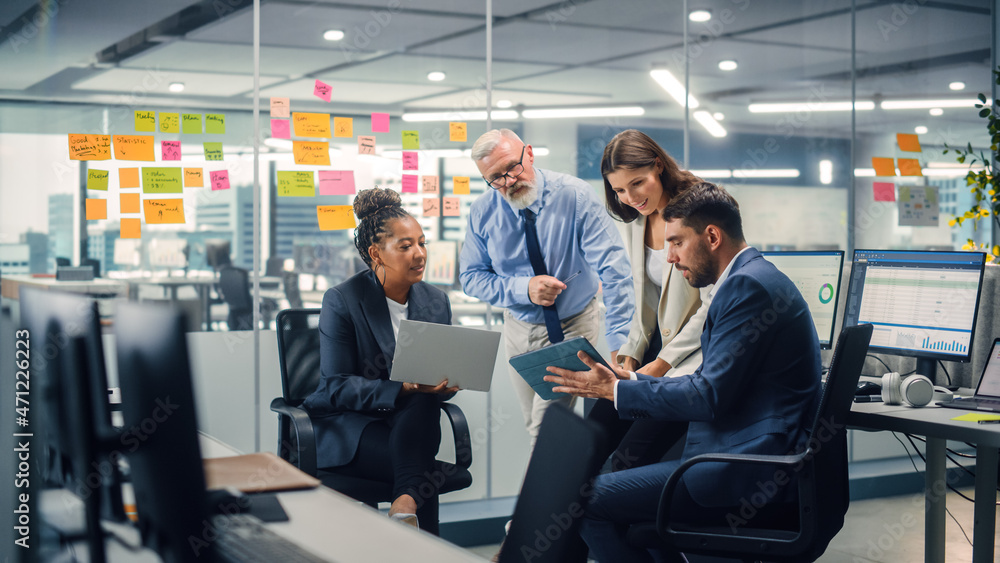 Poster in modern office: diverse team of managers use laptop and tablet computers at a company meeting disc