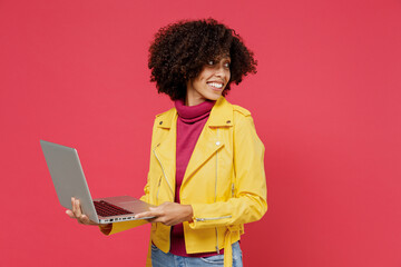 Happy fun businesslike smiling cheery young curly black latin woman 20s years old wears yellow...