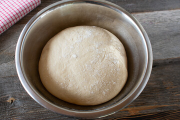 Rising yeast dough in a bowl
