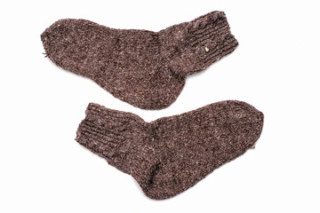 knitted wool warm socks on a white background