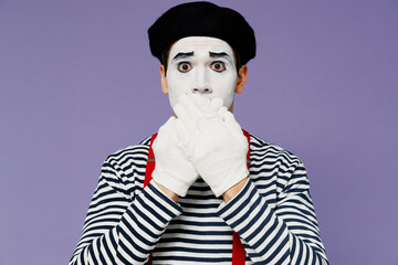 Secret strict silence young mime man with white face mask wears striped shirt beret covering mouth...