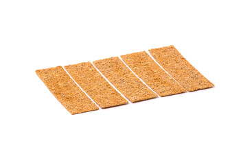 Pile of bread cracker snacks isolated over the white background.