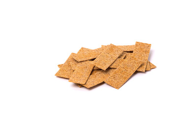 Pile of bread cracker snacks isolated over the white background.