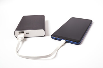 Smartphone is charging from the power bank.