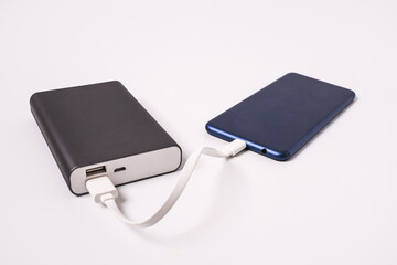 Smartphone is charging from the power bank.