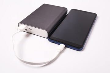 Smartphone is charging from the power bank.