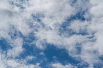 The bright blue sky was surrounded by white clouds, the atmosphere was like heaven.