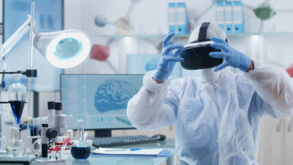 Scientist researcher doctor wearing virtual reality googles analyzing brain activity structure...