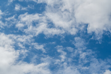 The bright blue sky was surrounded by white clouds, the atmosphere was like heaven.