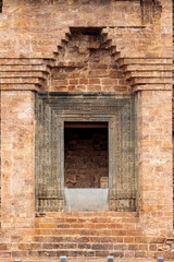 Fototapeta na wymiar Entrance gate of the Jagamohana the assembly hall (or porch) of the Konark Sun Temple, Orissa, India. The entrance is fashioned from green chlorite