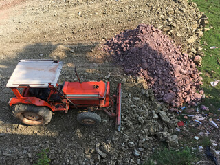 bulldozer dirt leveling on plot of land - 471230081