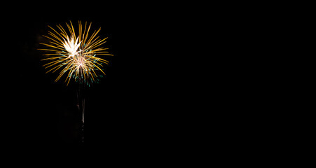 Festive fireworks on black background. Colorful celebration. Copy space.