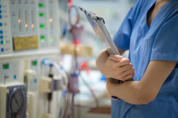 The specialist are checking continuous renal replacement therapy equipment and injection pump and...