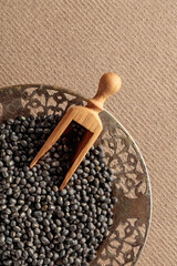 Raw uncooked black lentils (lens culinaris).