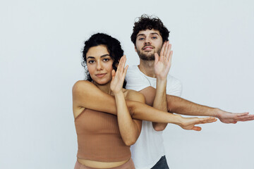 woman and man engaged in paired gymnastics yoga asana