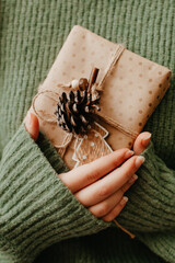 Female hands holding nice gift box, close up