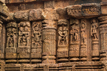 Temple platform of Jagamohana carved with  erotic couples, young women flaunting their beauty in poses, nagas, vyalas, soldiers, elephants, court scenes Sun Temple Konark, Odisha, India.