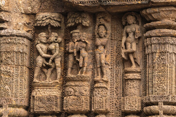 Temple platform of Jagamohana carved with  erotic couples, young women flaunting their beauty in poses, nagas, vyalas, soldiers, elephants, court scenes Sun Temple Konark, Odisha, India.