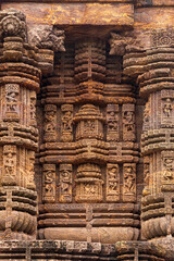 Carvings of  musicians and dancers that almost completely cover the platform, walls and pillars of the hall on Bhoga Mandapa or the dance hall, Sun Temple, Konark, India.