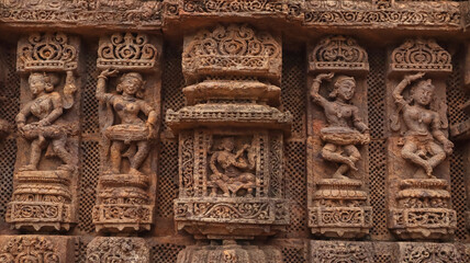 Carvings of  musicians and dancers that almost completely cover the platform, walls and pillars of...