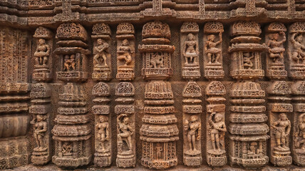 Carvings of  musicians and dancers that almost completely cover the platform, walls and pillars of the hall on Bhoga Mandapa or the dance hall, Sun Temple, Konark, India.