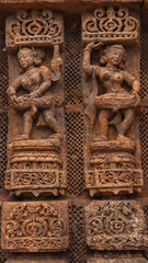 Carvings of  musicians and dancers that almost completely cover the platform, walls and pillars of the hall on Bhoga Mandapa or the dance hall, Sun Temple, Konark, India.