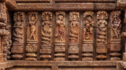 Temple platform of Jagamohana carved with  erotic couples, young women flaunting their beauty in poses, nagas, vyalas, soldiers, elephants, court scenes Sun Temple Konark, Odisha, India.