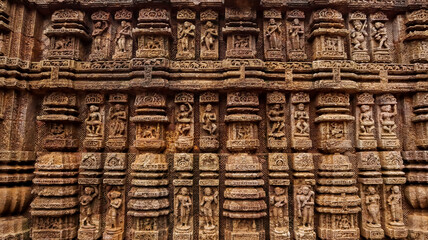 Carvings of  musicians and dancers that almost completely cover the platform, walls and pillars of...