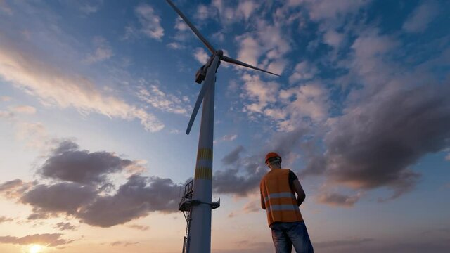 Wind turbine generator worker helmet engineer blue cloud sky industry power concept 4k