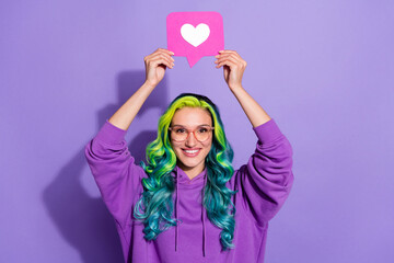 Fototapeta na wymiar Photo of youth lady with blue bright hairdo hold heart icon head repost comment post isolated over purple color background
