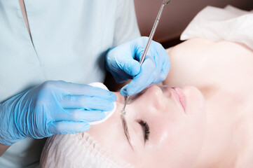 Luxury Close-up Professional face cleaning. Mechanical face cleansing procedure. Peeling of the skin of the face.