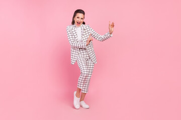 Full size photo of cheerful funky mature lady feeling young dancing in club isolated on pink color background