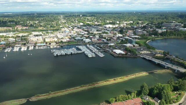 Cinematic 4K aerial drone pan shot of the Olympia Yacht Club near the Washington State Capitol Building and Campus, Capitol Lake, with a panoramic view of Historic District in Olympia, Washington