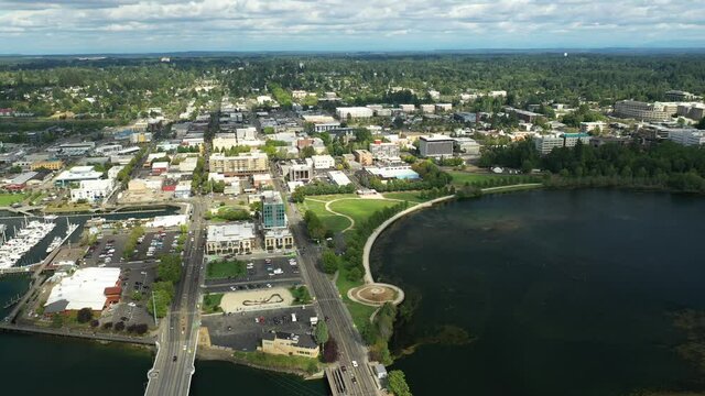 Cinematic 4K aerial drone video of the Olympia Yacht Club near the Washington State Capitol Building and Campus, Capitol Lake, with a panoramic view of Historic District in Olympia, Washington