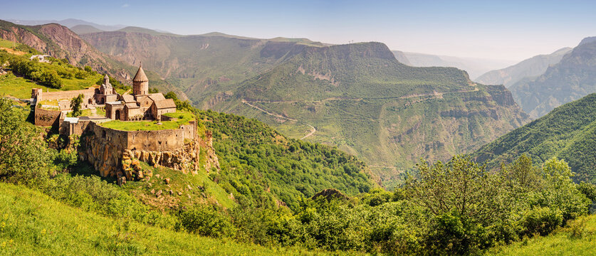 Majestic Tatev Monastery located on an inaccessible basalt rock with wonderful views of the Vorotan River gorge. Travel and worship attractions in Armenia